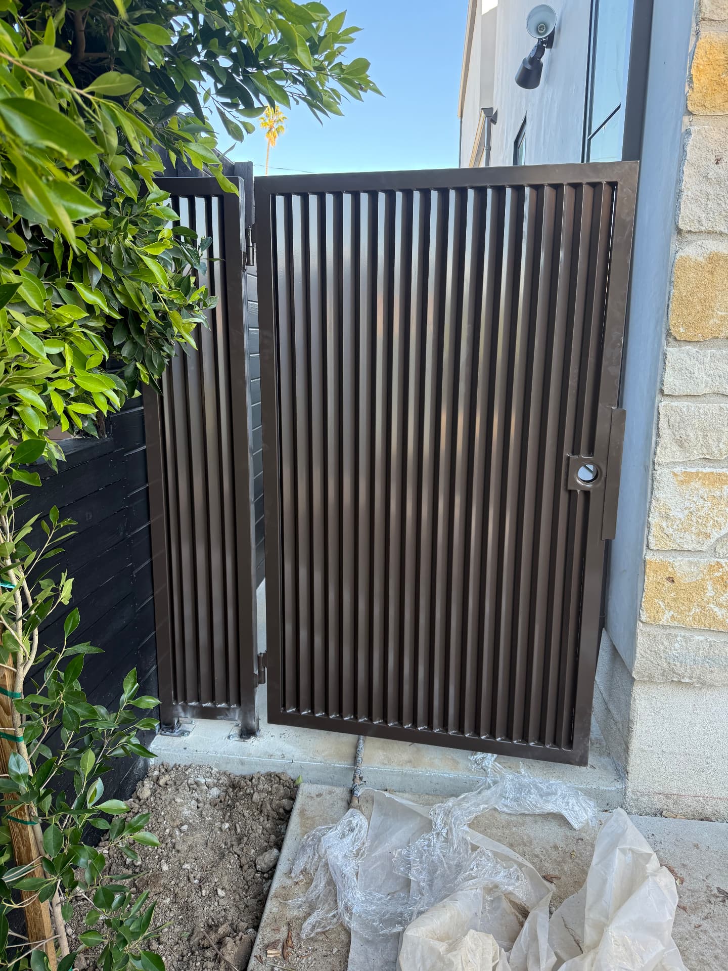 Bronze Slat Side Gate — Interior