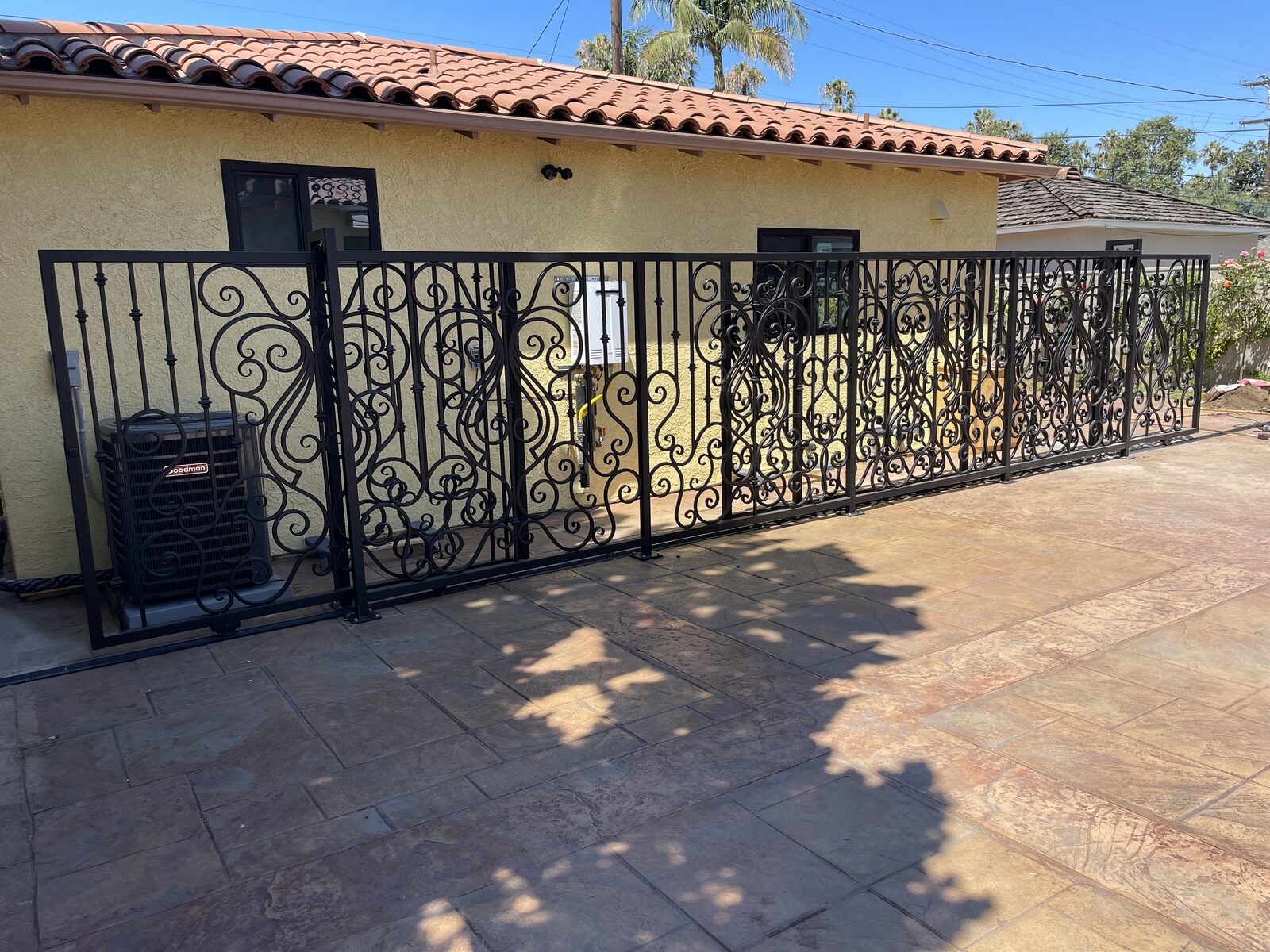 Ornate Scrollwork Courtyard Fence